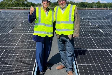 Cllr Julie Gooding, Vice Chair of Communities, Wellbeing & Housing Committee and Leader of Rochford District Council, Cllr James Newport, on the roof at Clements Hall Leisure Centre with the newly installed solar panels